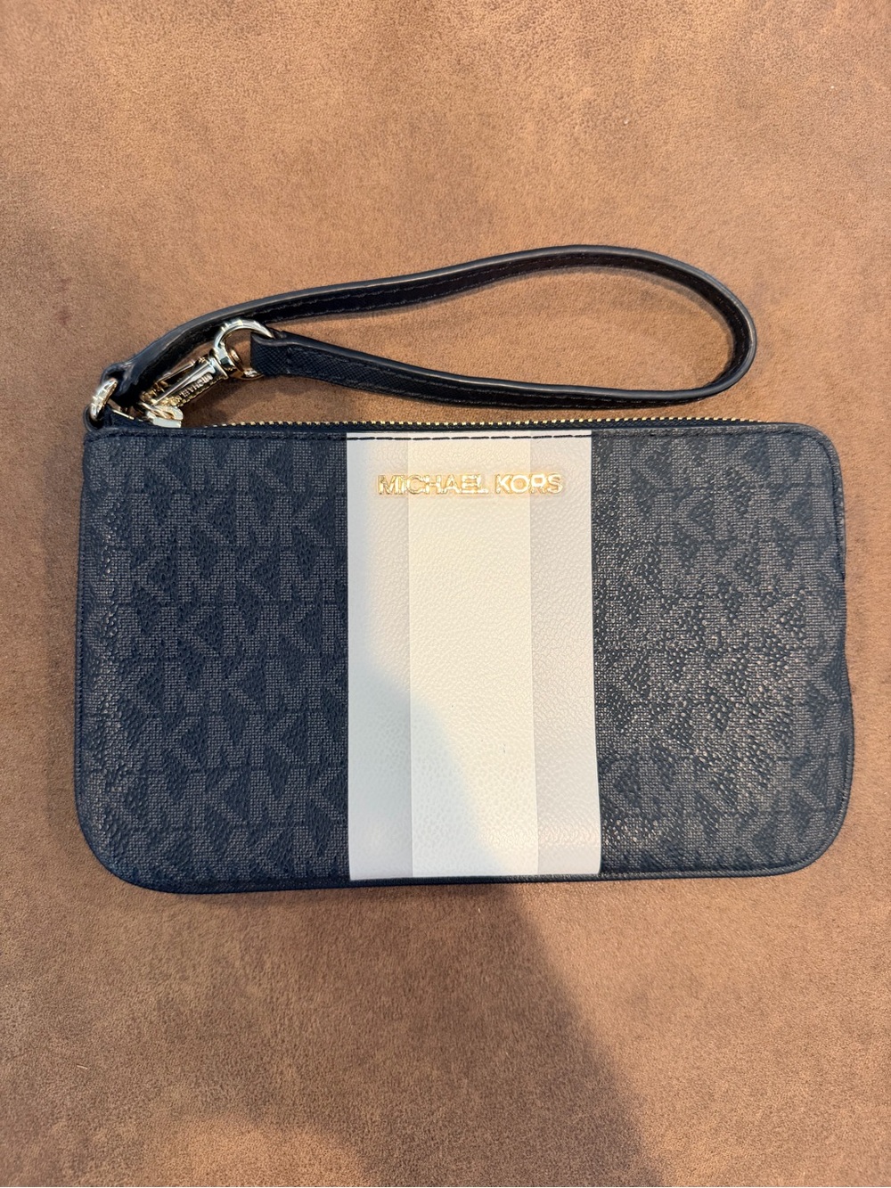 Michael Kors Black Wristlet with Cream Center Stripe and Gold Logo Plate